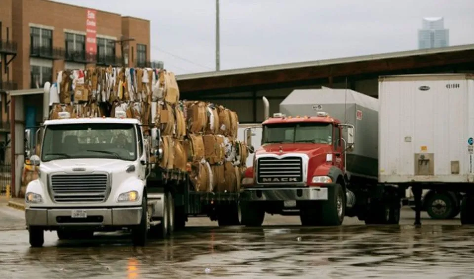Trucks with recycled material loaded